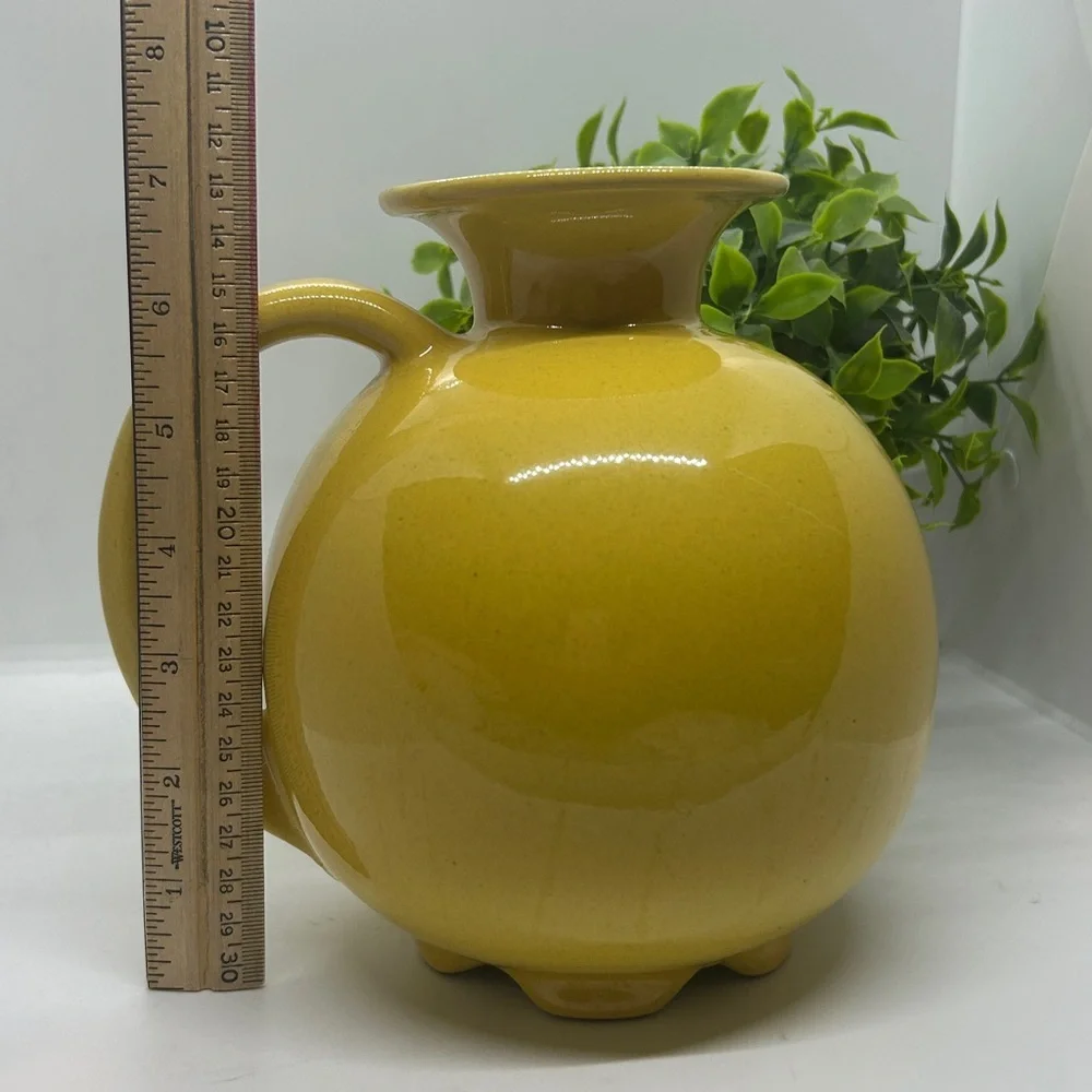 Frankoma Pottery Yellow MCM #82 Carafe dating back to the 1950s.